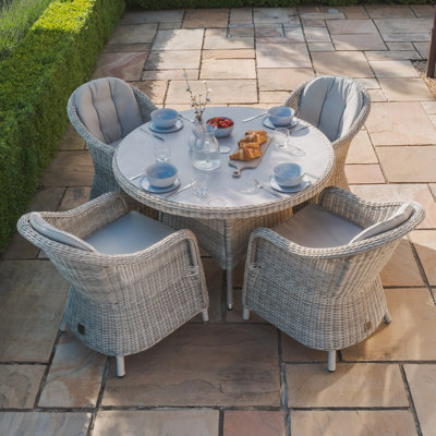 Anissah 4 - Person Patio Dining Set with Round Table
