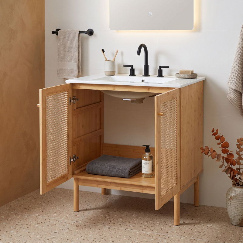Meuble-lavabo avec détails en rotin tissé à la main et lavabo en céramique élégant