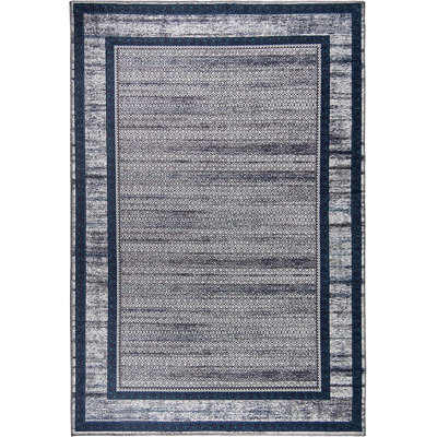 Rectangle Sebrina Machine Tufted Area Rug in Brown