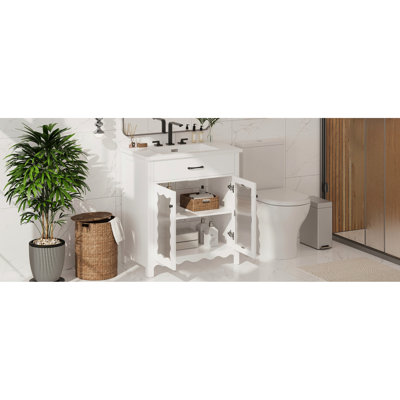 Meuble-lavabo de 79 cm (31 po) avec lavabo en céramique lisse, portes à fermeture amortie et pieds en bois d'hévéa pour une stabilité optimale. Profil courbé de 79 cm (31 po), structure robuste et fiable.