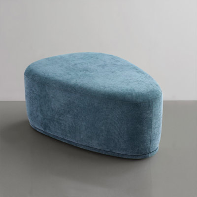 Caras Triangular Upholstered Ottoman by Wade Logan