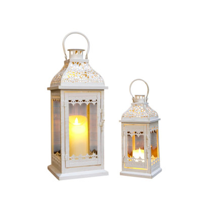 Ensemble de deux porte-bougies de table en métal filigrané crème patiné