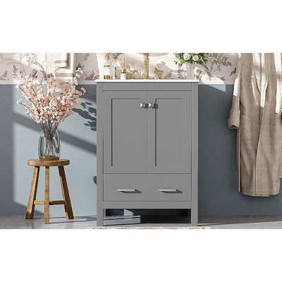 Meuble-lavabo de 24 pouces avec lavabo encastré intégré et armoire de rangement avec 2 portes et 1 tiroir. Comprend une tablette de porte à double couche, une conception à fermeture douce et des solutions de rangement polyvalentes