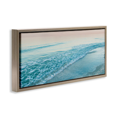 Cadre flottant lumineux sur une plage, design par Mary Lou Johnson