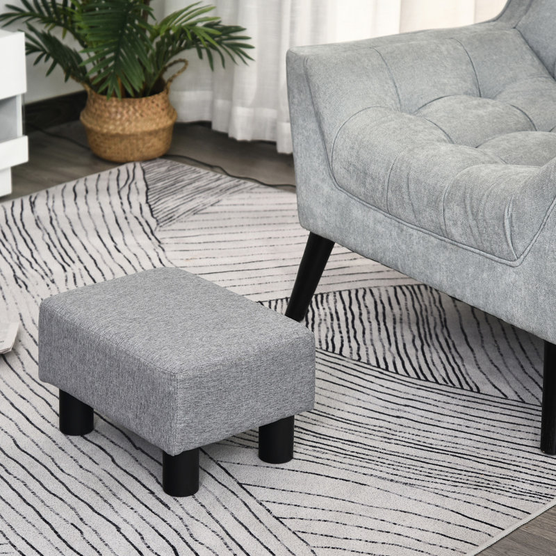 Tabouret gris avec housse en lin et pieds robustes en plastique pour le repos de style salon, petit
