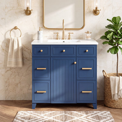 Meuble-lavabo de 91 cm (36 po) avec lavabo en céramique, structure en bois massif, portes à fermeture amortie, étagères réglables et 3 tiroirs avec rangement double profondeur pour sèche-cheveux.
