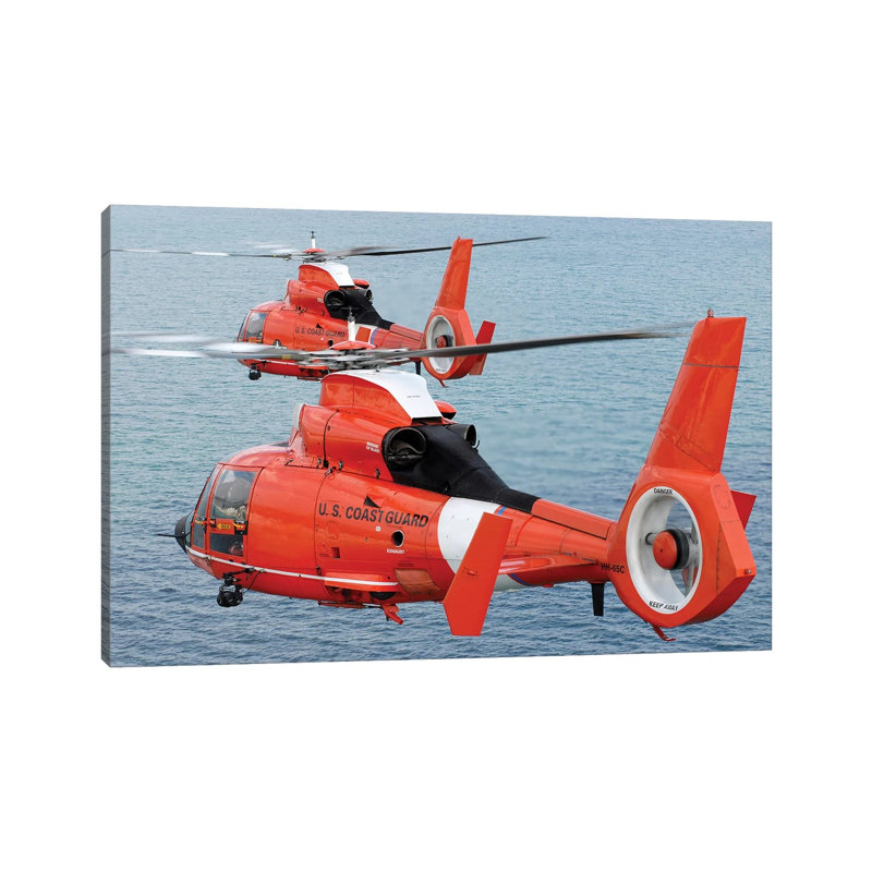 Two Coast Guard HH-65C Dolphin Helicopters Fly In Formation Over The Atlantic Ocean by Stocktrek Images - Wrapped Canvas Print