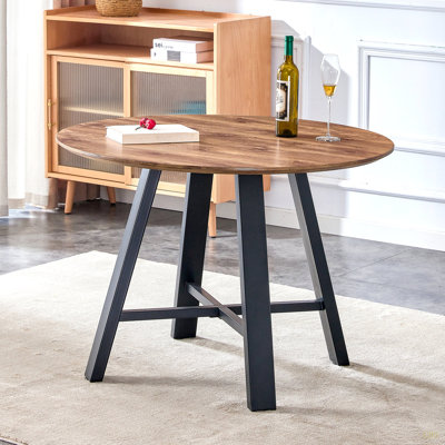 Une table de salle à manger moderne et minimaliste, une table basse. Bureau en bois aggloméré de 42 pouces de diamètre, pieds en métal, convenant à la maison et au bureau