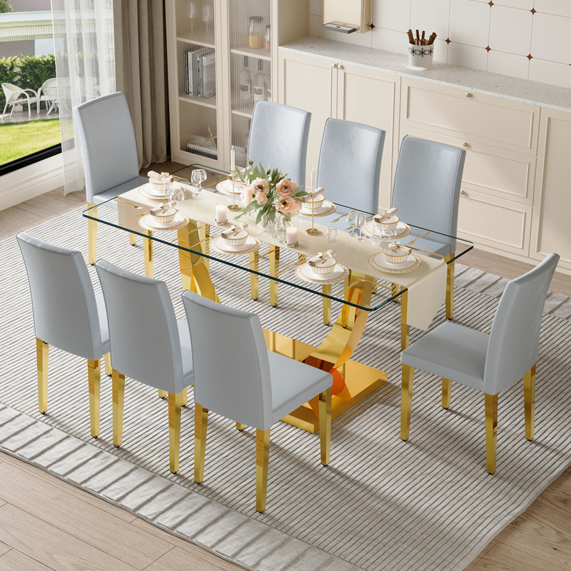 Ensemble de table de salle à manger moderne en verre trempé avec base en forme de V doré et chaises en cuir de polyuréthane, ensemble de table de salle à manger de luxe