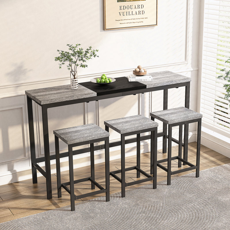Ensemble de table de salle à manger moderne et fonctionnel avec trois tabourets, idéal pour les petits espaces et la vie sans effort
