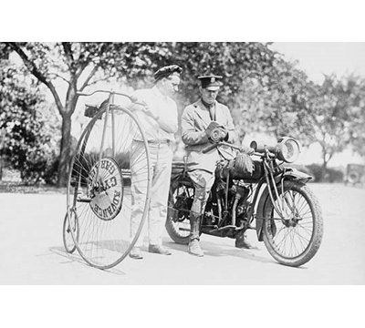 Motorcycle Cop Give A Bicycle Rider A Traffic Ticket For Speeding - Photograph