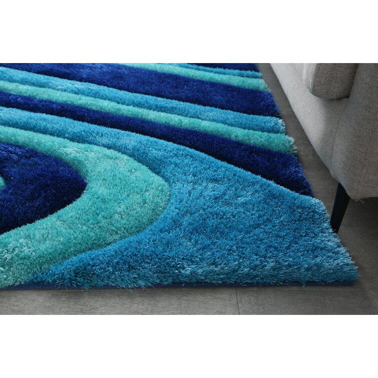 https://assets.wfcdn.com/im/67807956/resize-h755-w755%5Ecompr-r85/1895/189593550/Zandra+Handmade+Performance+Blue+Rug.jpg