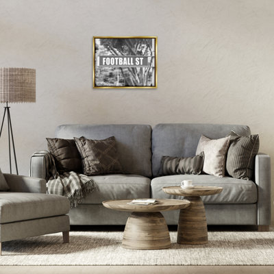 «Football Street Sign», art mural encadré noir sur toile flottante par Daphne Polselli