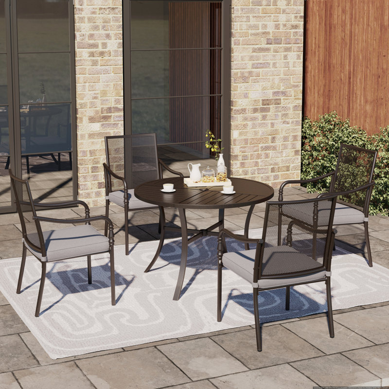Ensemble repas de patio pour 4 personnes avec table ronde Carli, coussins inclus