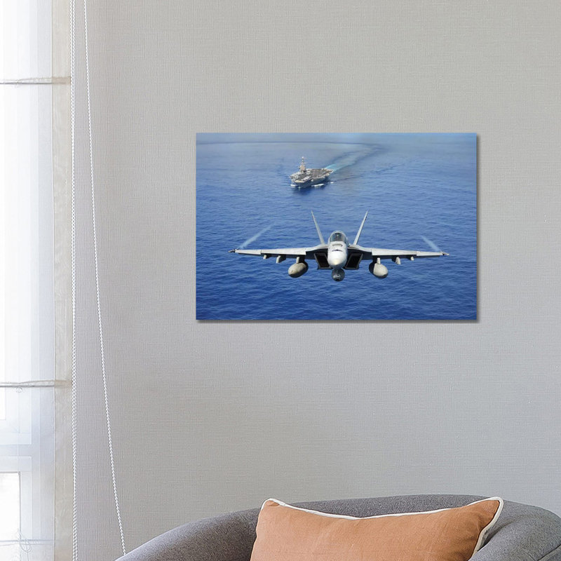 An F/A-18E Super Hornet Flying Above USS John C. Stennis by Stocktrek Images - Wrapped Canvas Print