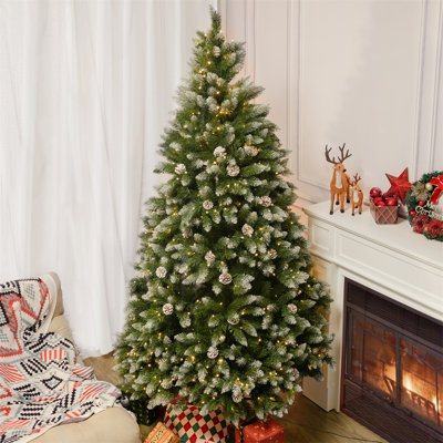White Sprayed Christmas Tree With Pinecones