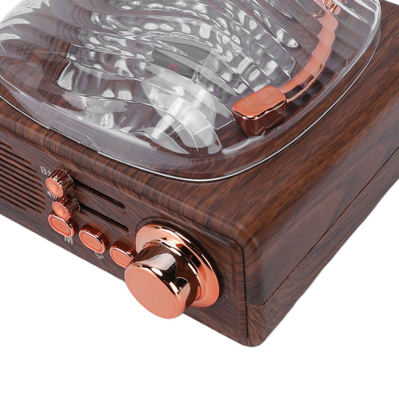 Lecteur de CD portatif avec haut-parleur Bluetooth, radio FM, ports USB et AUX, et veilleuse intégrée.