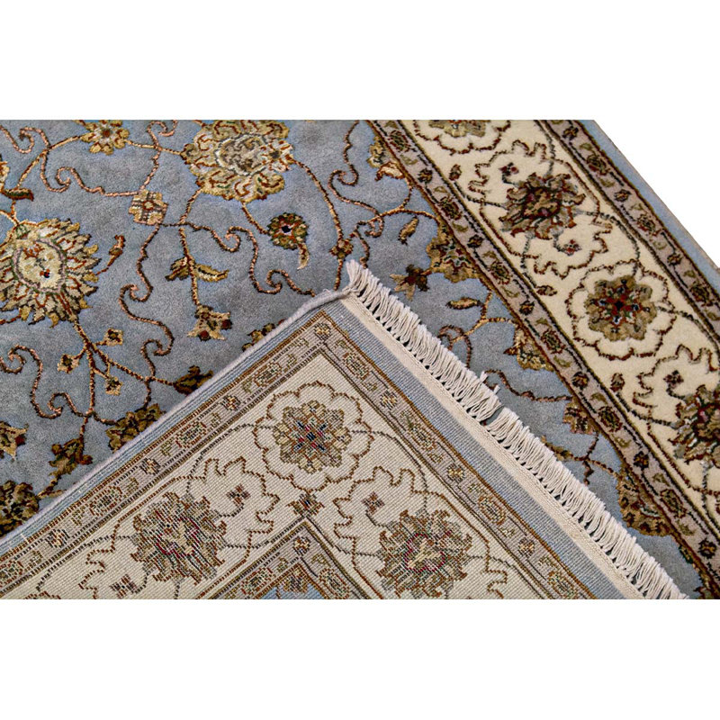 Tapis bleu et ivoire de haute qualité noué à la main