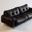 Causeuse-coussin modulable noire en cuir véritable-128966713