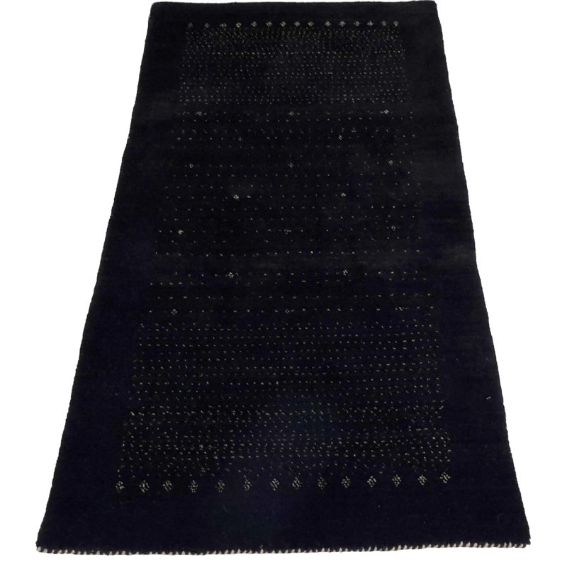 Ovide Polka Dots Area Rug in Black