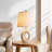 24" Modern Ceramic Table Lamp with Sculptural Ring Base and Polished Nickel Accents