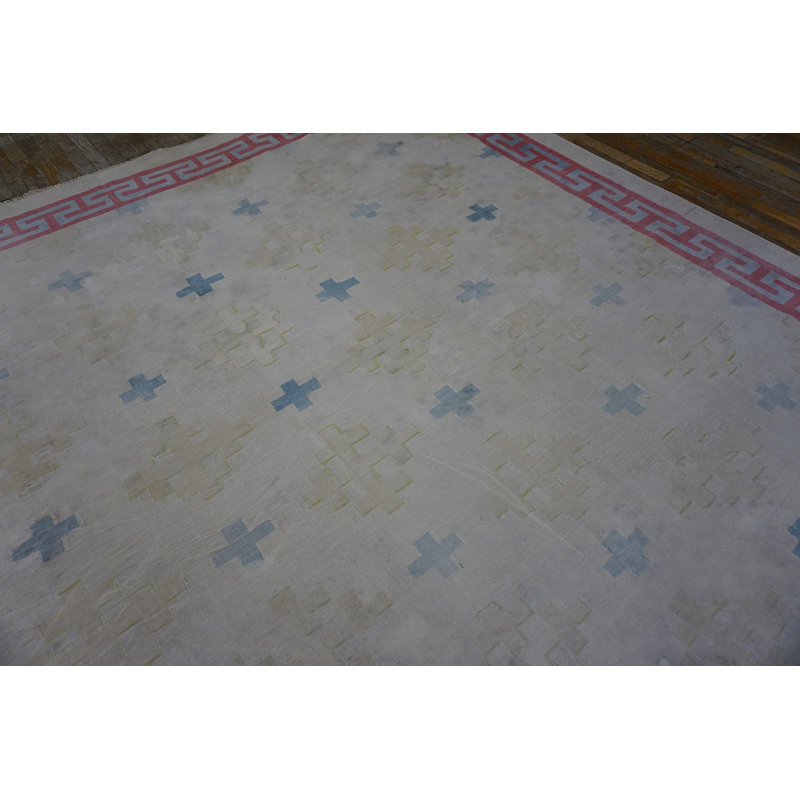 Tapis carré tissé à plat à motif géométrique délavé de couleur crème délavé