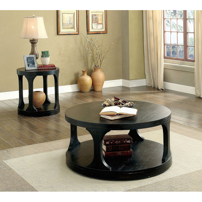 Table basse ronde de style transitionnel au fini noir antique avec tablette de rangement supplémentaire et pieds en forme de I