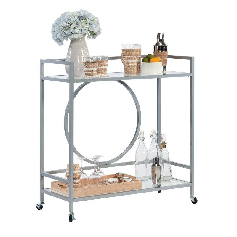 Élégant chariot à roulettes contemporain avec finition argentée, deux tablettes en verre, verrouillables pour les espaces de vie et tablettes grises durables pour la cuisine, installation rapide