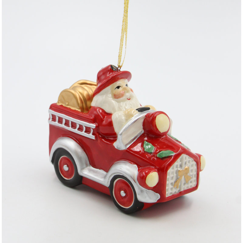 Ornement père Noël conduisant un camion de pompiers - H 3 1/4 po