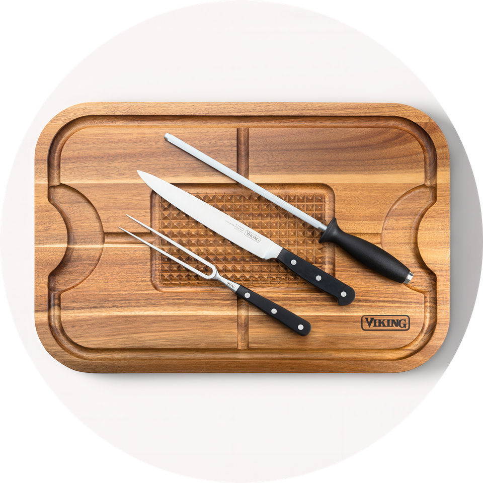 Viking carving board with knife, fork, and sharpening steel.