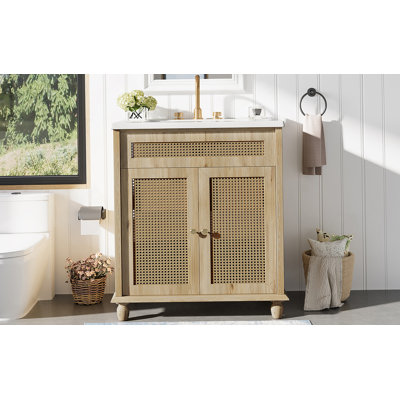 Meuble-lavabo avec portes en rotin tissé à la main, pieds en bois massif et lavabo en résine pour une mise à niveau naturelle et fonctionnelle de la salle de bain