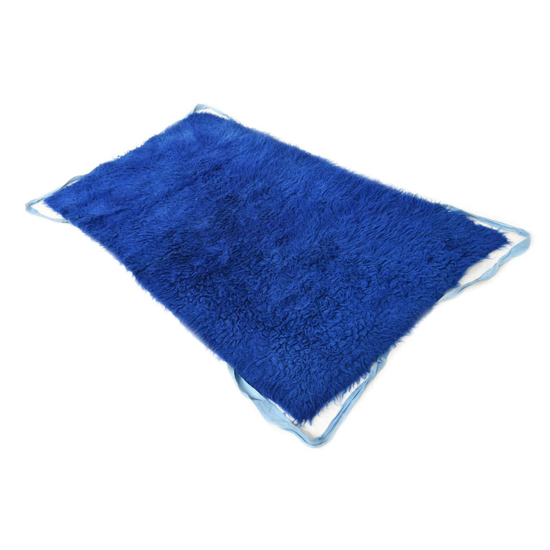 Tapis bleu Kalmanovitz