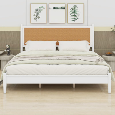 Platform bed frame with woven headboard and boho coastal style