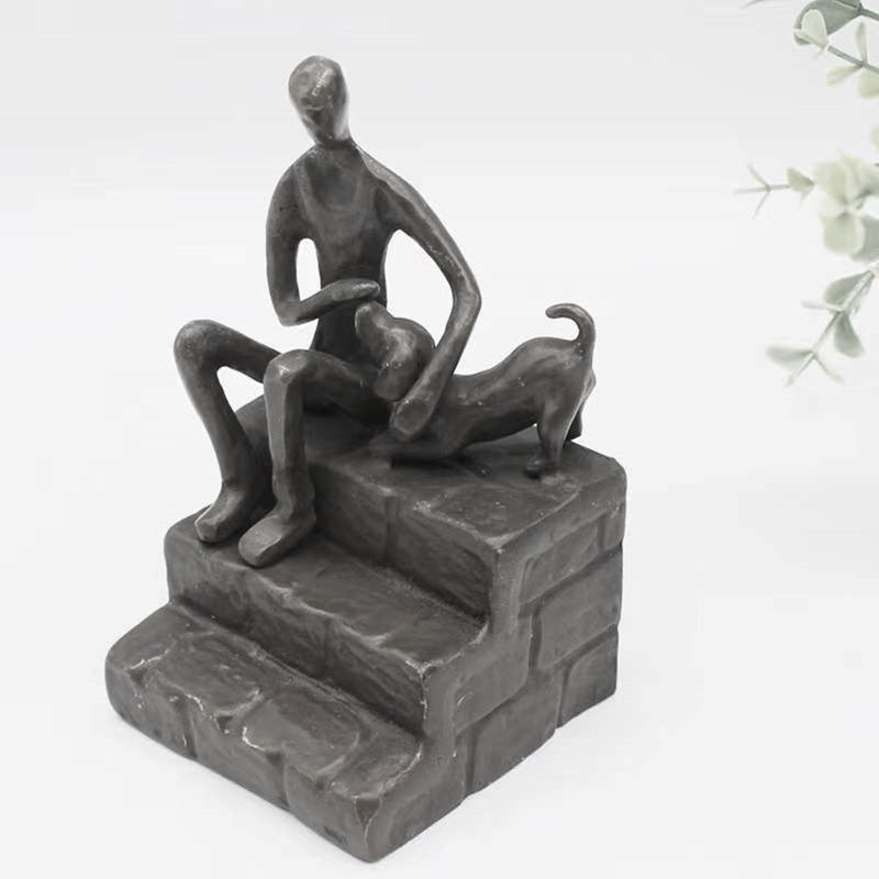 Figurine Dibiase homme caressant un chiot
