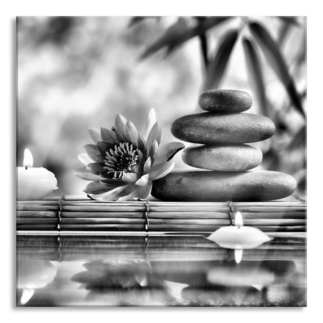 Glasbild Seerose mit Zen-Steinen im Tempel