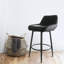 Chaise de bar en similicuir noir avec pieds en métal