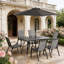 Ensemble repas d'extérieur avec parasol réglable en hauteur et table en verre facile à nettoyer