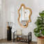 Miroir mural de forme irrégulière avec cadre en bois naturel