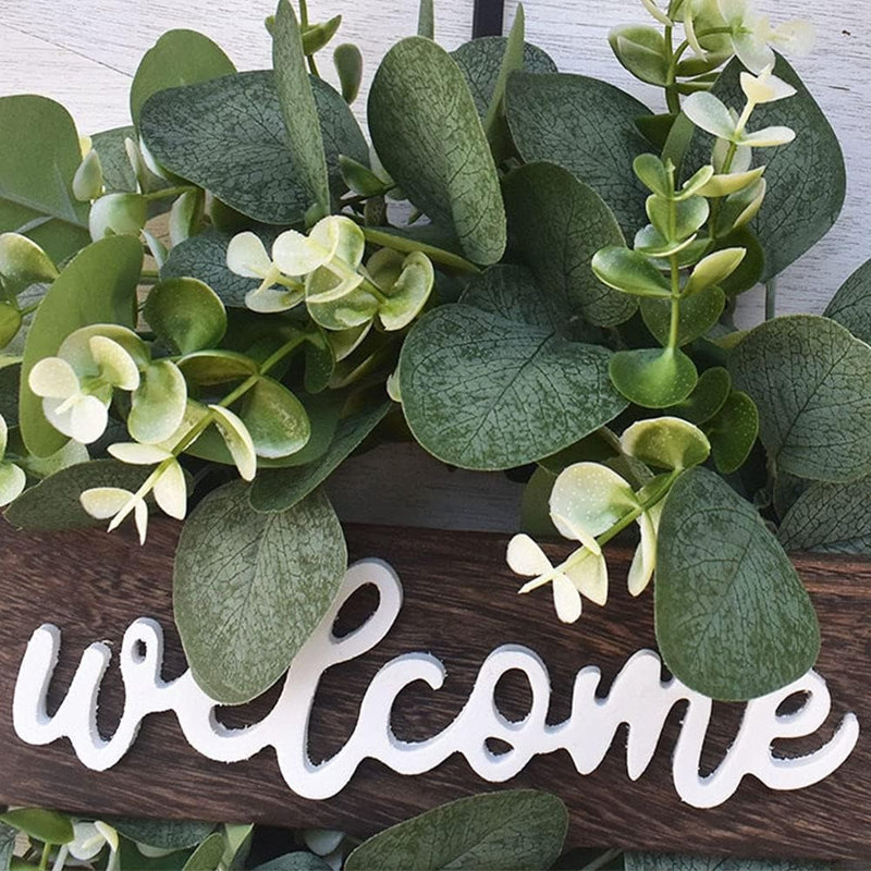 Couronne d'eucalyptus vert avec signe de bienvenue