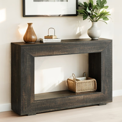 Console gris foncé avec base ouverte pour les entrées mezzanine