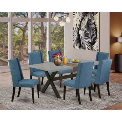 Ensemble de table et chaises de cuisine 7 pièces comprenant une table de salle à manger rectangulaire avec pieds en X et 6 chaises Parsons en tissu bleu, noir brossé