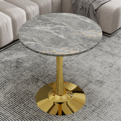 Cette table basse de 27,6 pouces de style Mid-Century moderne peut accueillir de 2 à 4 personnes et est dotée d'un plateau rond en marbre texturé gris foncé qui convient à divers environnements.