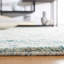 Tapis turquoise / ivoire en laine tissée à la main Pecktonville-78163635