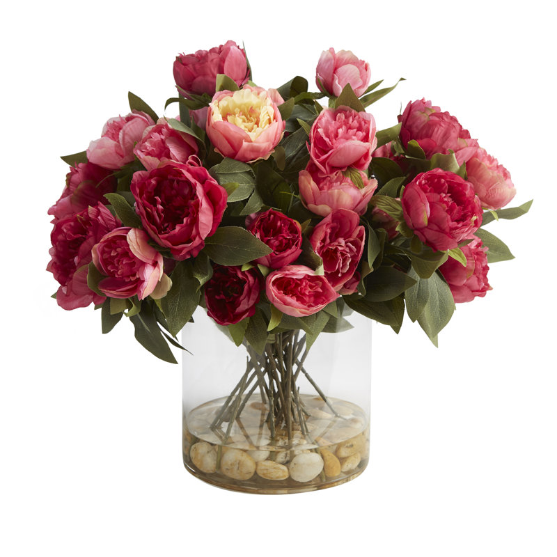 Pivoines dans un vase en verre rond