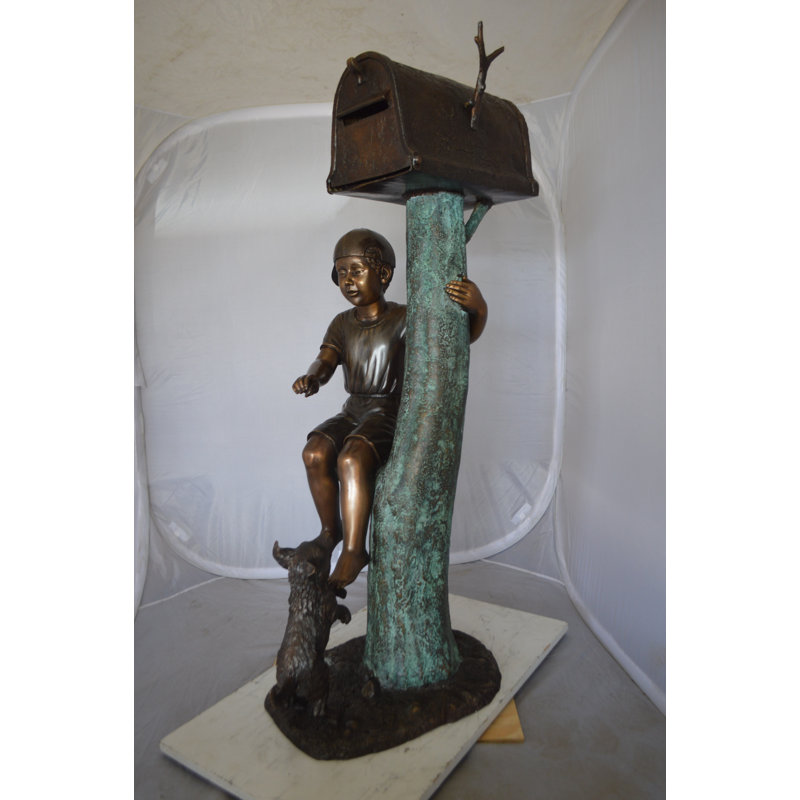 Boy Sitting on a Tree with Mailbox Bronze Statue -  Size: 22"L x 23"W x 49"H. 