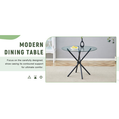 Une table ronde circulaire en verre trempé transparent d'un diamètre de 36,6 pouces, avec des pieds en métal noir rassemblés en forme d'anneau. Le verre du bureau a une épaisseur de 0,3 pouce.