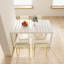Lot de 4 chaises modernes à rayures avec pieds en polypropylène imperméable et métal pour repas à l'intérieur/extérieur, assise bicolore blanc crème et jaune grainé pour balcon.