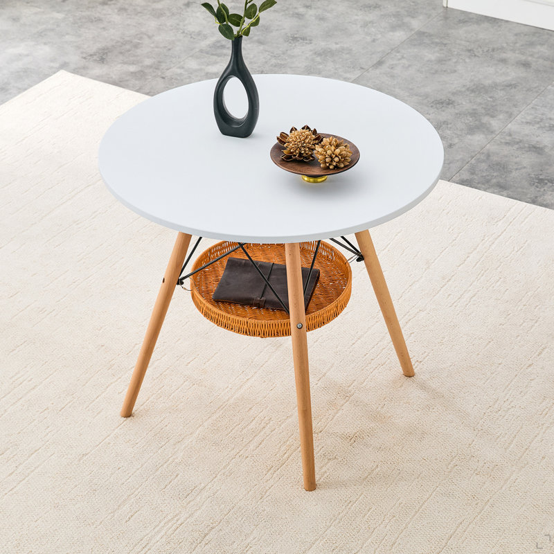 Table de salle à manger circulaire de 31,5 pouces de diamètre, plateau de table en panneau de fibres à densité moyenne blanc, pieds en bois massif, avec structure de panier de rangement tissé suspendu. Une table basse décontractée convenant à 2 à 4 personnes.