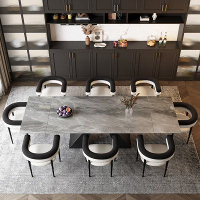 Ensemble de table de salle à manger extensible 9 pièces en pierre frittée avec 8 accoudoirs en tissu Doinita