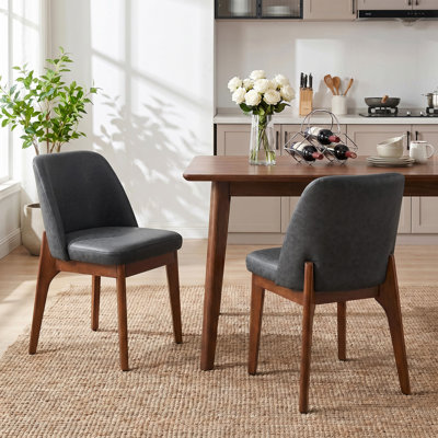 Chaise de salle à manger rembourrée en similicuir de style Mid-Century avec pieds fuselés en bois massif (ensemble de 2)
